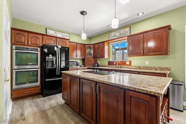 1103 Greenmont Cir, Vienna, WV 26105 - kitchen with black appliances, light wood finished floors, a center island, hanging light fixtures, and recessed lighting