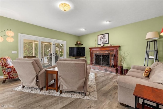 1103 Greenmont Cir, Vienna, WV 26105 - living area featuring wood finished floors and a brick fireplace