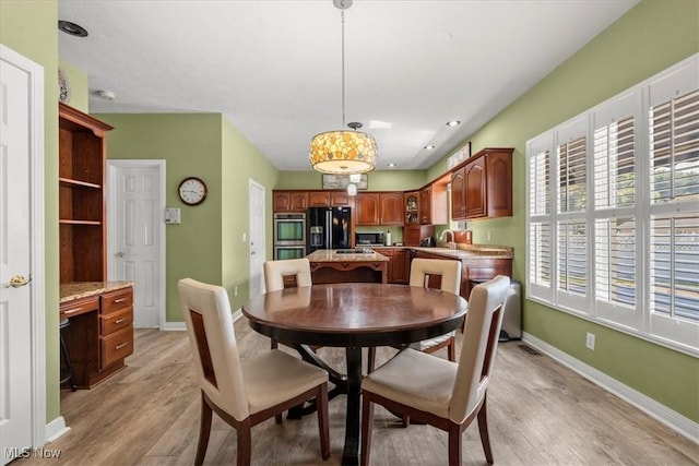 1103 Greenmont Cir, Vienna, WV 26105 - dining room with light wood finished floors and baseboards