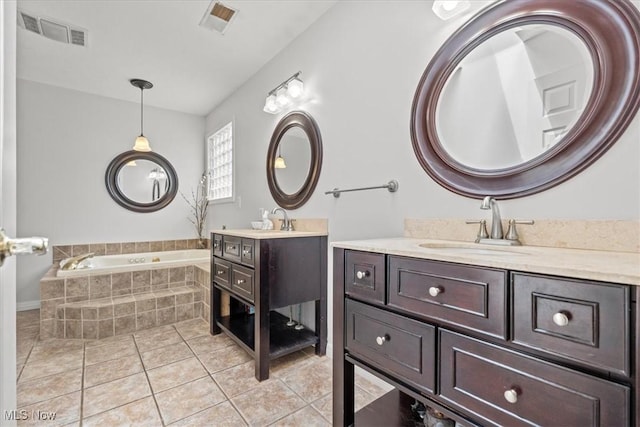 1103 Greenmont Cir, Vienna, WV 26105 - bathroom featuring a garden tub, two vanities, and tile patterned flooring