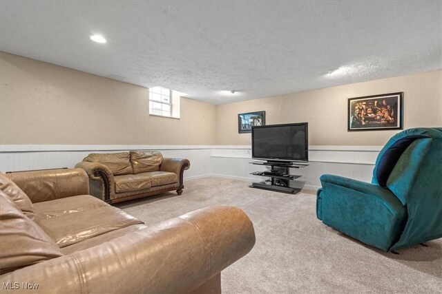 1103 Greenmont Cir, Vienna, WV 26105 - living area with carpet, wainscoting, and a textured ceiling