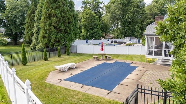 1103 Greenmont Cir, Vienna, WV 26105 - view of pool featuring a patio area, a sunroom, and a fenced backyard