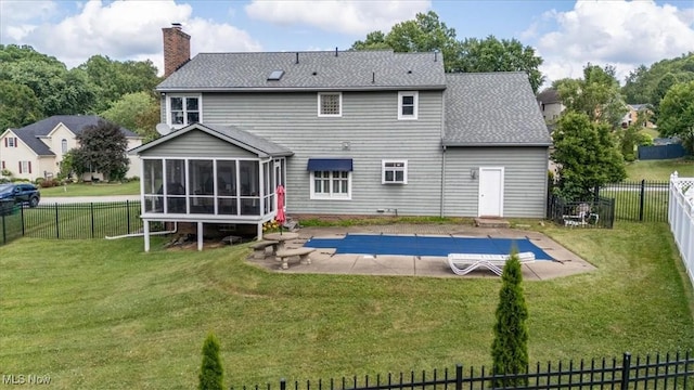 1103 Greenmont Cir, Vienna, WV 26105 - rear view of property with a patio, a sunroom, a chimney, a fenced backyard, and a shingled roof