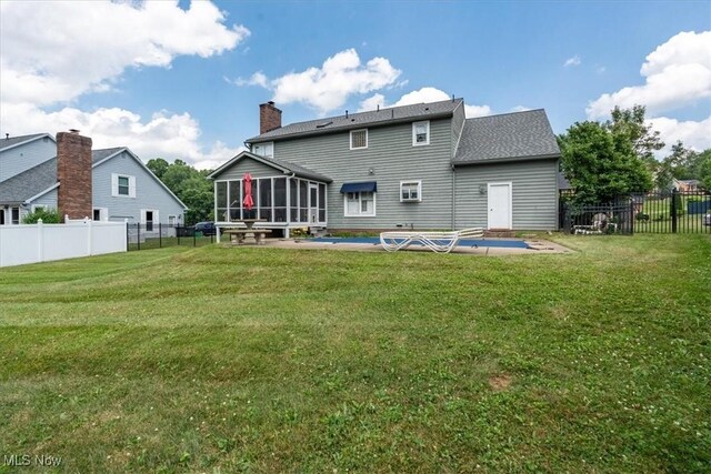 1103 Greenmont Cir, Vienna, WV 26105 - rear view of house featuring a sunroom, a fenced backyard, and a patio