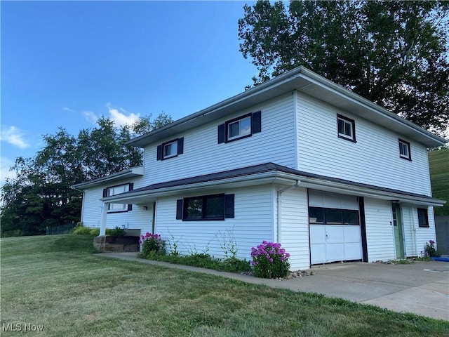 100 Crestview Dr, Newcomerstown, OH 43832 - view of front of house with a front yard, a garage, and driveway