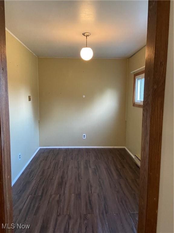 100 Crestview Dr, Newcomerstown, OH 43832 - empty room with dark wood-style flooring and baseboard heating