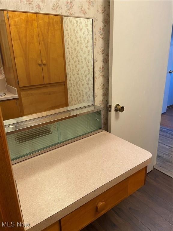 100 Crestview Dr, Newcomerstown, OH 43832 - bathroom with wallpapered walls, wood finished floors, and vanity