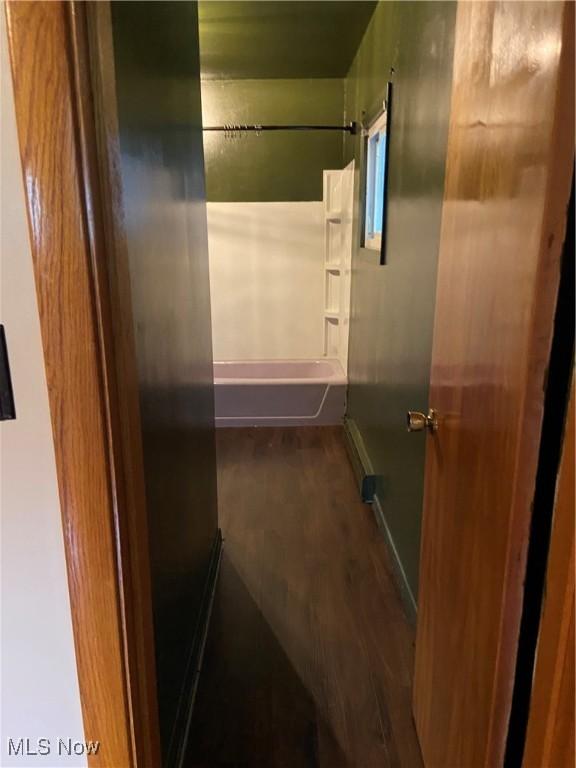 100 Crestview Dr, Newcomerstown, OH 43832 - bathroom featuring shower / tub combination and wood finished floors
