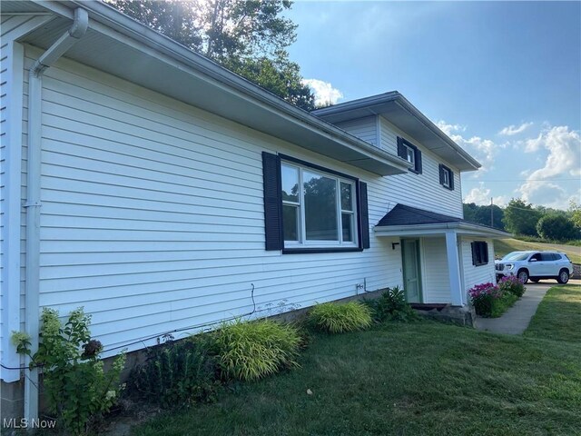 100 Crestview Dr, Newcomerstown, OH 43832 - view of home's exterior with a yard