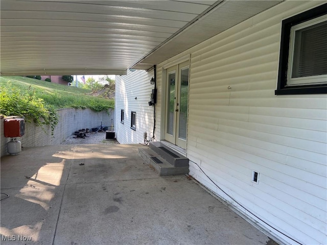 100 Crestview Dr, Newcomerstown, OH 43832 - view of patio / terrace with french doors and entry steps