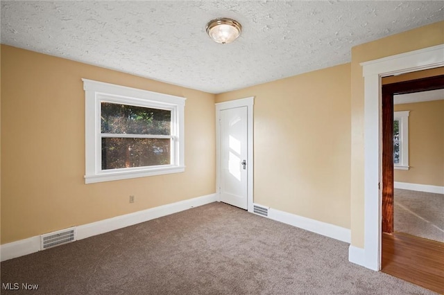 57 Charles Ave, Boardman, OH 44512 - unfurnished bedroom featuring carpet flooring, a textured ceiling, and a closet