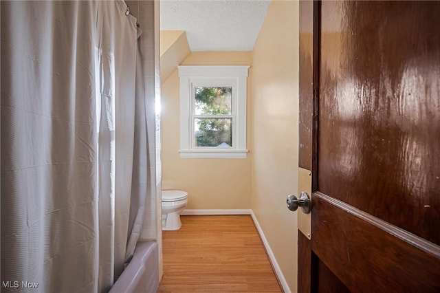 57 Charles Ave, Boardman, OH 44512 - bathroom with wood finished floors and shower / bath combination with curtain