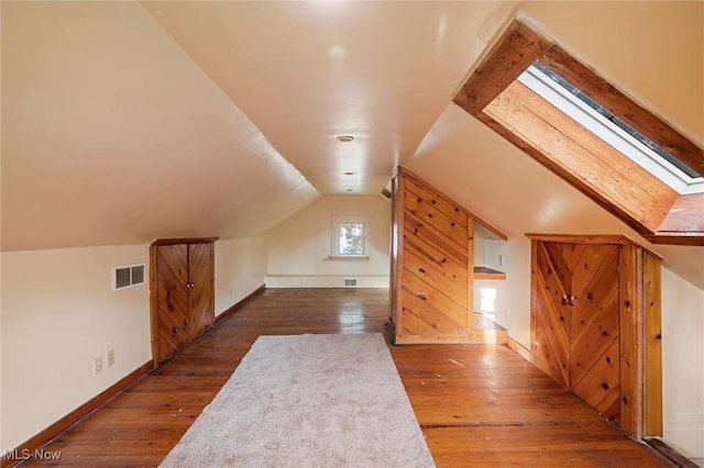 57 Charles Ave, Boardman, OH 44512 - additional living space with hardwood / wood-style flooring, lofted ceiling, and a skylight