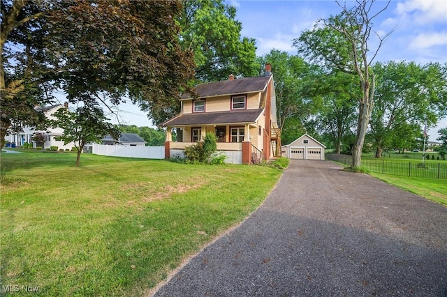 57 Charles Ave, Boardman, OH 44512 - view of front of house with a garage, a chimney, an outdoor structure, and covered porch