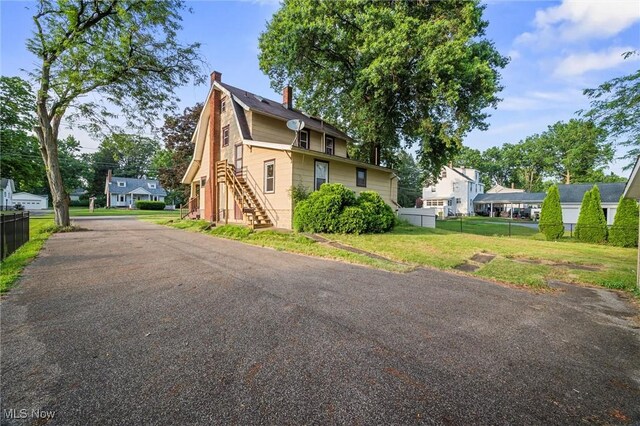 57 Charles Ave, Boardman, OH 44512 - view of side of property featuring stairway and a chimney