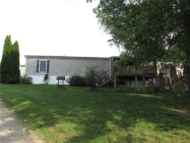 114 Quail Ln, Saint Marys, WV 26170 - rear view of property featuring stairs, a wooden deck, and a lawn
