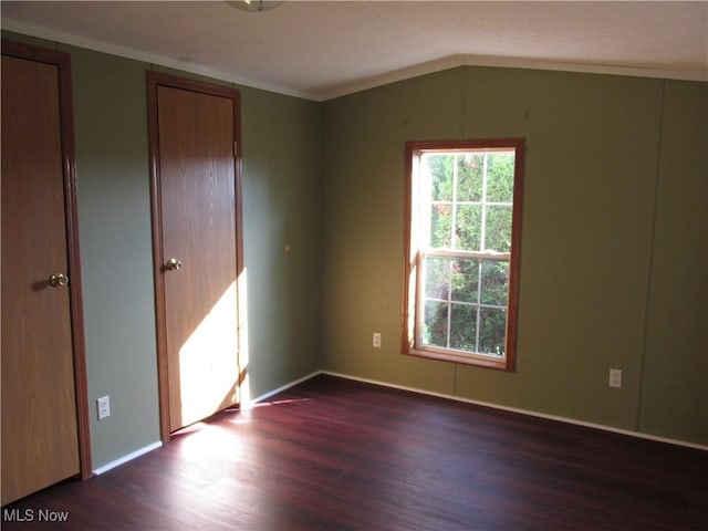114 Quail Ln, Saint Marys, WV 26170 - empty room with dark wood-style floors, crown molding, and lofted ceiling