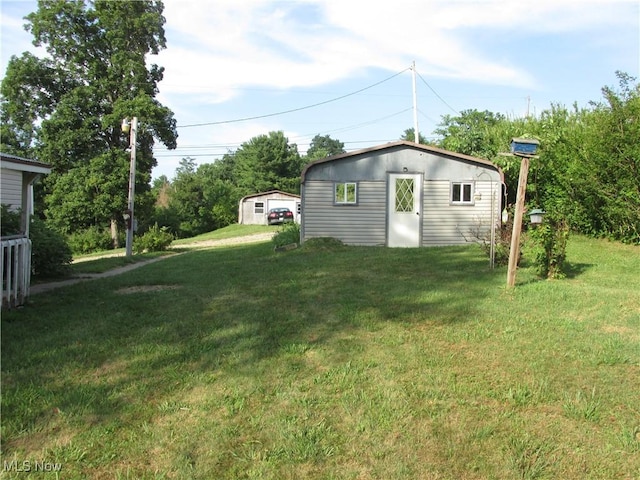114 Quail Ln, Saint Marys, WV 26170 - view of grassy yard featuring an outbuilding