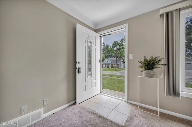 484 E 319th St, Willowick, OH 44095 - entrance foyer featuring light colored carpet and light tile patterned floors