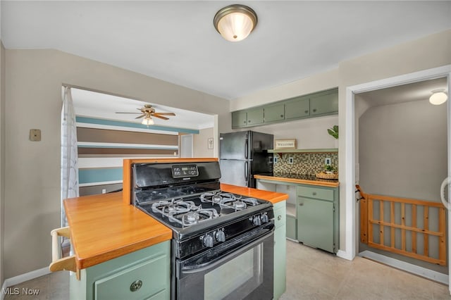 484 E 319th St, Willowick, OH 44095 - kitchen with green cabinets, black appliances, wood counters, tasteful backsplash, and ceiling fan