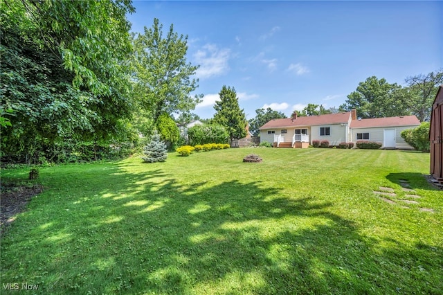 484 E 319th St, Willowick, OH 44095 - view of grassy yard featuring a fire pit