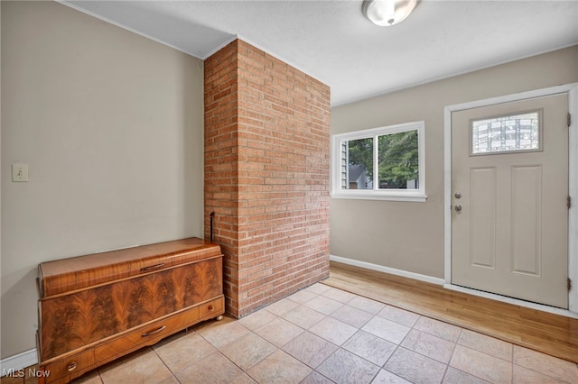 484 E 319th St, Willowick, OH 44095 - foyer entrance featuring light tile patterned floors and baseboards