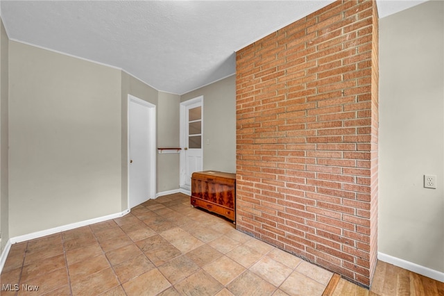 484 E 319th St, Willowick, OH 44095 - spare room featuring brick wall