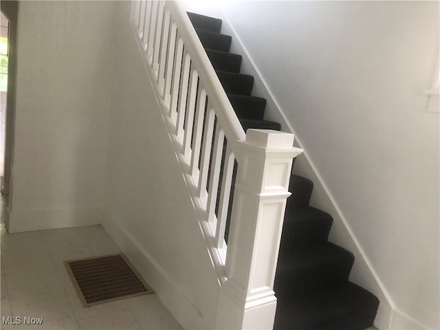 204 Beech Rd, Weirton, WV 26062 - staircase featuring baseboards and tile patterned floors
