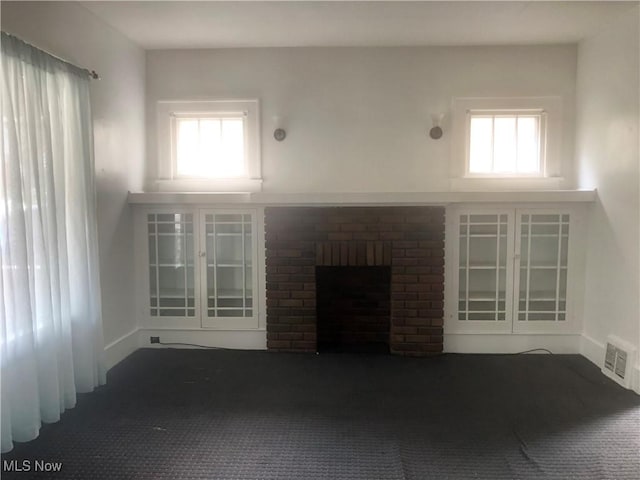 204 Beech Rd, Weirton, WV 26062 - unfurnished living room featuring a brick fireplace and baseboards