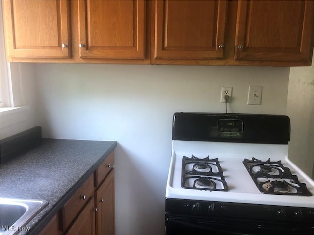 204 Beech Rd, Weirton, WV 26062 - kitchen with range with gas cooktop and dark countertops