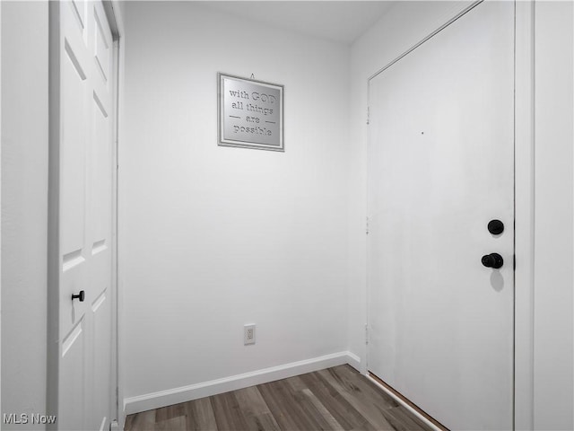1217 W River Rd N Unit A3, Elyria, OH 44035 - doorway to outside featuring dark wood-style floors and baseboards
