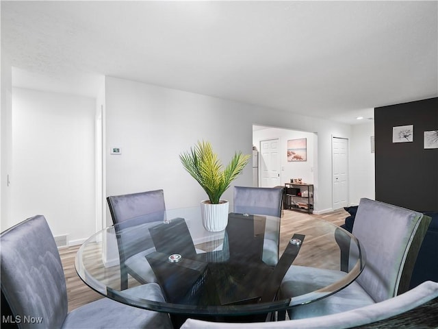 1217 W River Rd N Unit A3, Elyria, OH 44035 - dining area featuring light wood finished floors