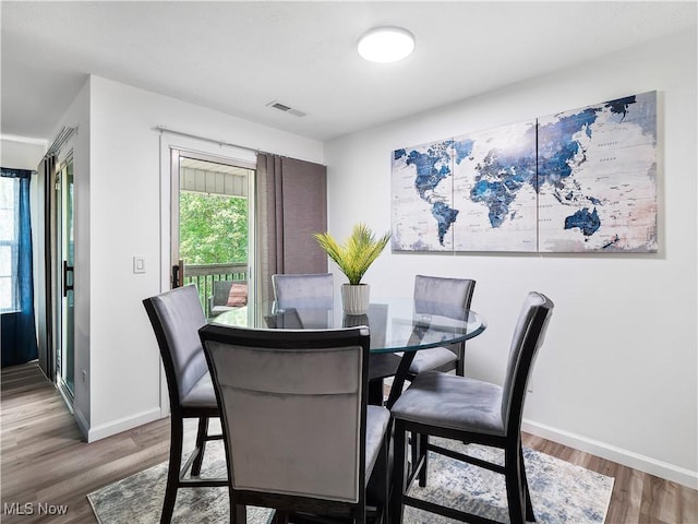 1217 W River Rd N Unit A3, Elyria, OH 44035 - dining space featuring light wood-style floors and baseboards