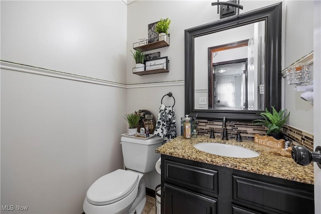 26938 Tall Oaks Trl, Olmsted Twp, OH 44138 - half bath featuring vanity, tasteful backsplash, and tile patterned floors