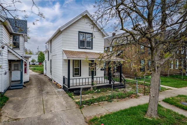 1411 E 47th St, Cleveland, OH 44103 - view of front of house with a porch, roof with shingles, driveway, and entry steps
