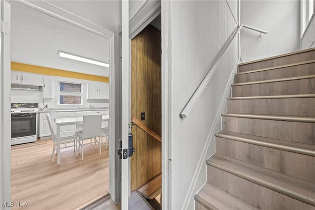 1411 E 47th St, Cleveland, OH 44103 - stairs with wood finished floors
