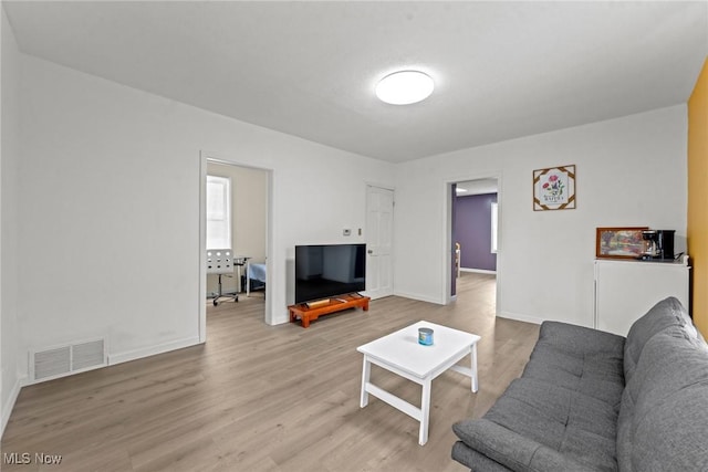 1411 E 47th St, Cleveland, OH 44103 - living area featuring wood finished floors and baseboards