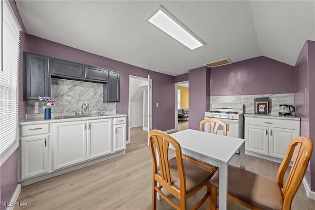 1411 E 47th St, Cleveland, OH 44103 - dining space featuring light wood-style flooring and lofted ceiling