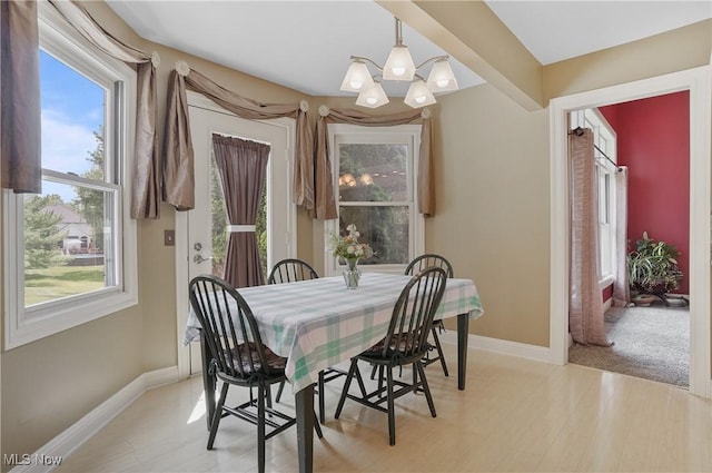 8883 Michaels Ln, Broadview Heights, OH 44147 - dining space featuring a chandelier and light wood-type flooring