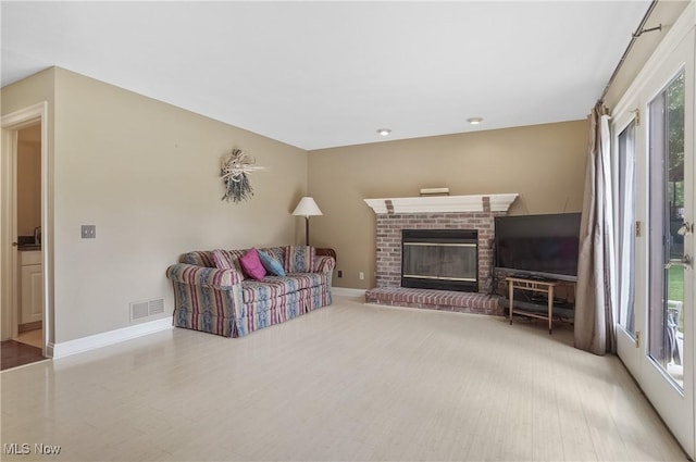 8883 Michaels Ln, Broadview Heights, OH 44147 - living room with healthy amount of natural light and a brick fireplace