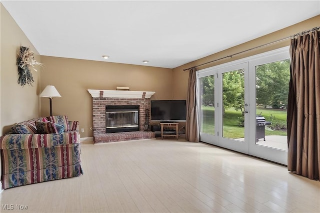 8883 Michaels Ln, Broadview Heights, OH 44147 - living room with a fireplace, wood finished floors, and recessed lighting