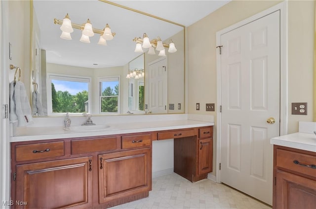 8883 Michaels Ln, Broadview Heights, OH 44147 - bathroom featuring vanity, a chandelier, and tile patterned floors