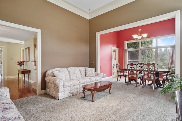 8883 Michaels Ln, Broadview Heights, OH 44147 - carpeted living area with a chandelier and ornamental molding
