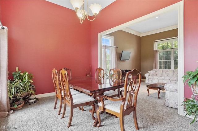 8883 Michaels Ln, Broadview Heights, OH 44147 - dining space featuring carpet flooring, a chandelier, and ornamental molding