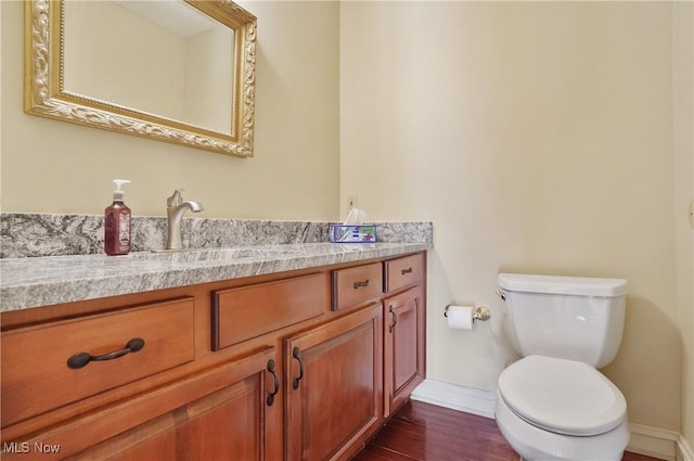 8883 Michaels Ln, Broadview Heights, OH 44147 - half bathroom featuring vanity and wood finished floors