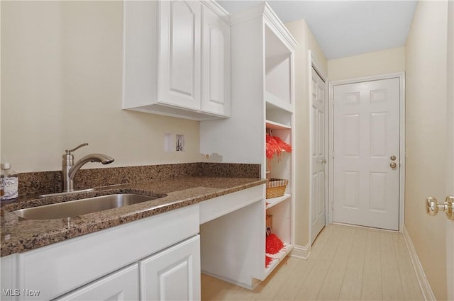 8883 Michaels Ln, Broadview Heights, OH 44147 - kitchen featuring white cabinets, dark stone countertops, and light wood-type flooring