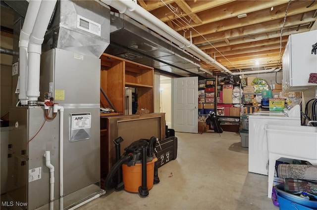 8883 Michaels Ln, Broadview Heights, OH 44147 - unfinished below grade area featuring washer and dryer and heating unit