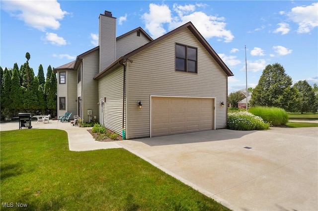 8883 Michaels Ln, Broadview Heights, OH 44147 - view of side of home featuring an attached garage, a yard, and a chimney