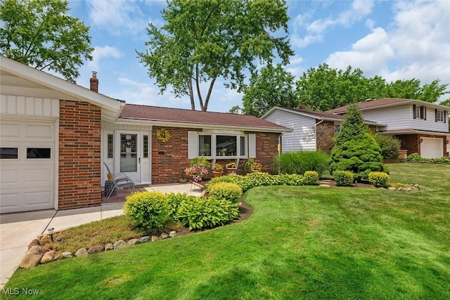 6122 Forest Ridge Dr, North Olmsted, OH 44070 - view of front of home with brick siding, a chimney, a front lawn, an attached garage, and driveway