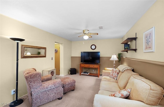6122 Forest Ridge Dr, North Olmsted, OH 44070 - living area with carpet flooring, ceiling fan, and wainscoting